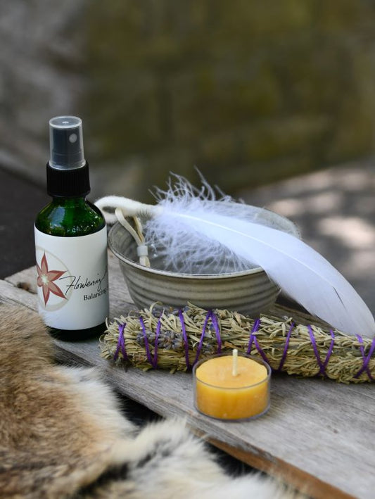 Smudge ritual kit with sage, feather, candle, bowl and balancing spray